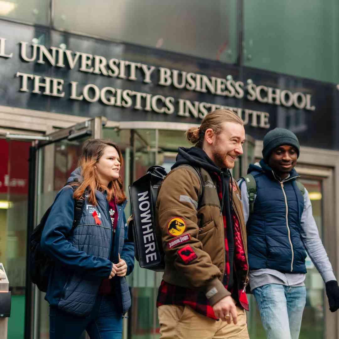 Three students walk out of the logistic institute's Nidd Building
