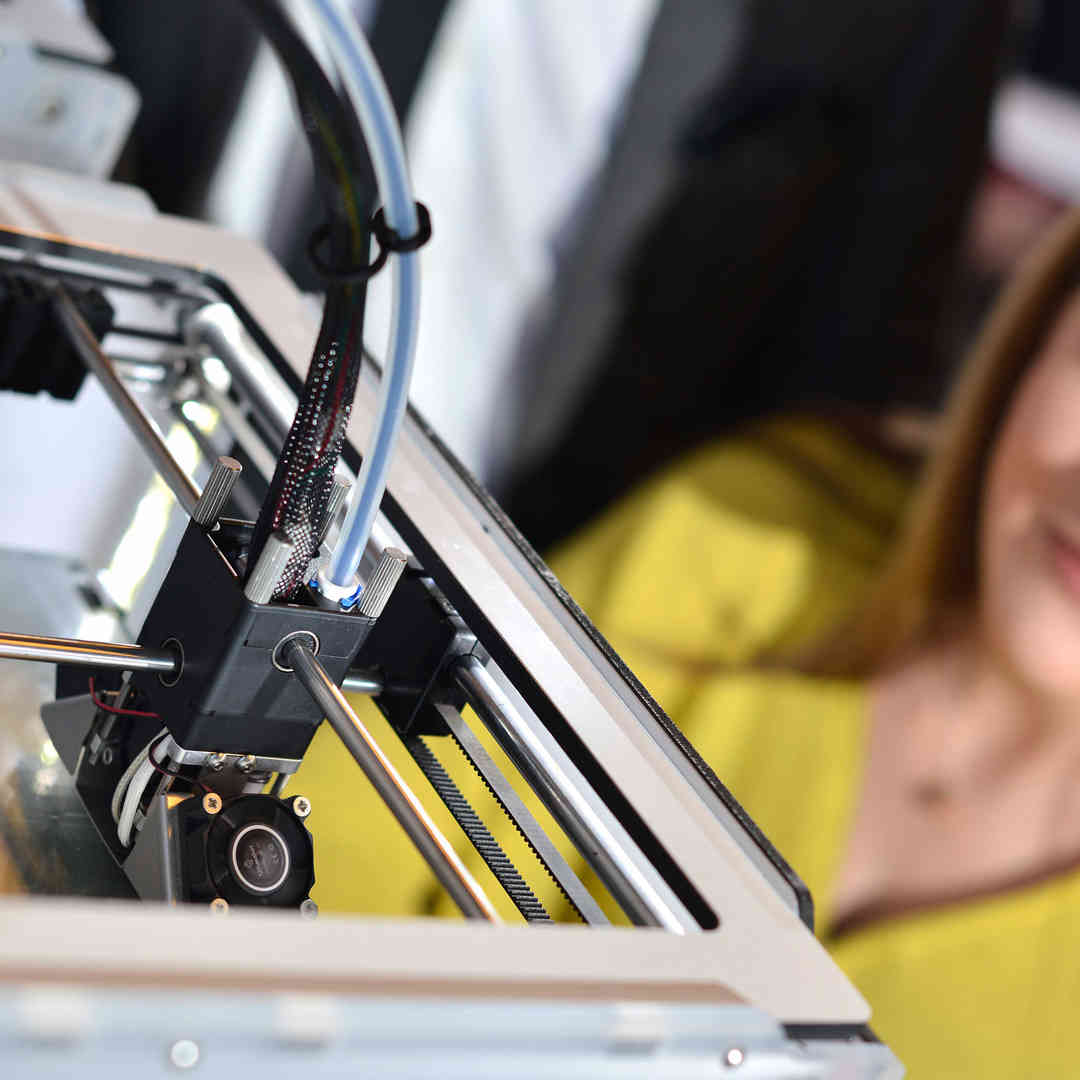 A medical engineering student using a 3D printer as part of her studies.