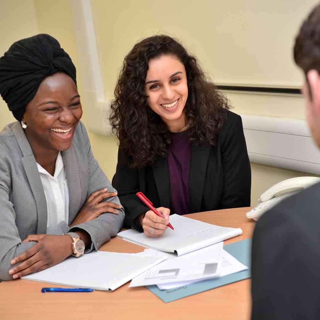 Two students working with a client in the Legal Advice Centre