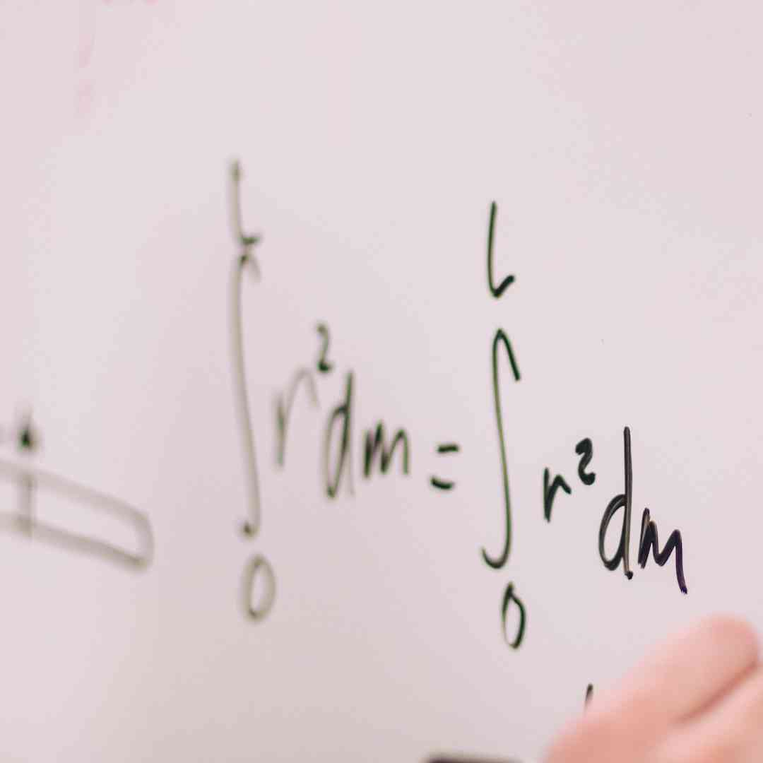 Mathematical equations written on a whiteboard