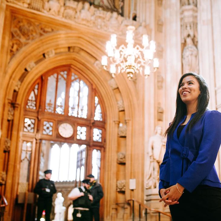 A smiling Politics student inside the Houses of Parliament while on placement at Westminster.