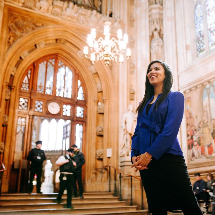 A smiling Politics student inside the Houses of Parliament while on placement at Westminster.