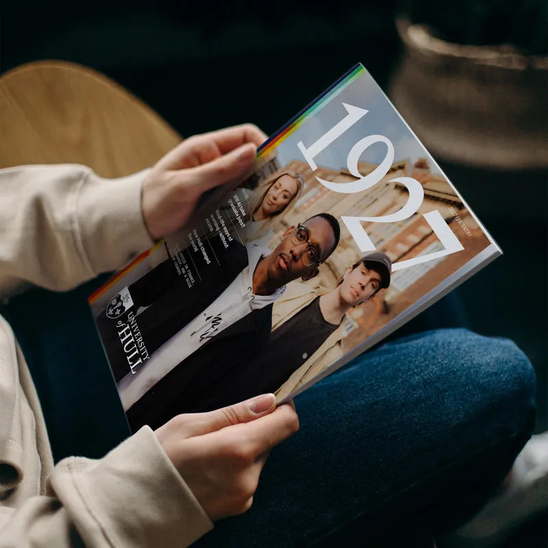 A student holds a copy of 1927 magazine