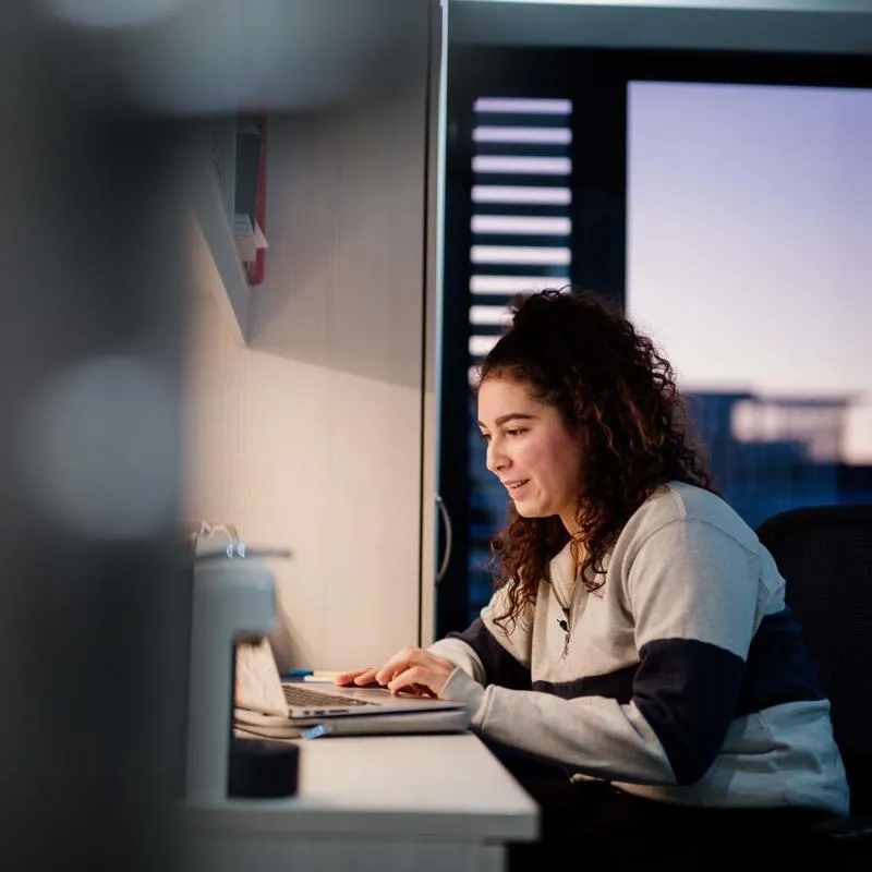 Student studying on a laptop in The Courtyard