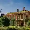Students walk past the front of one of the University's grade 2 listed buildings