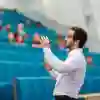 Business School lecturer Tom Hoyland is mid flow in front of a class in a large lecture theatre