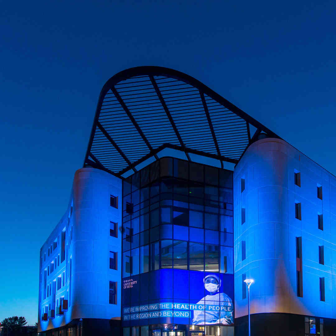 Allam Medical Building lit in blue