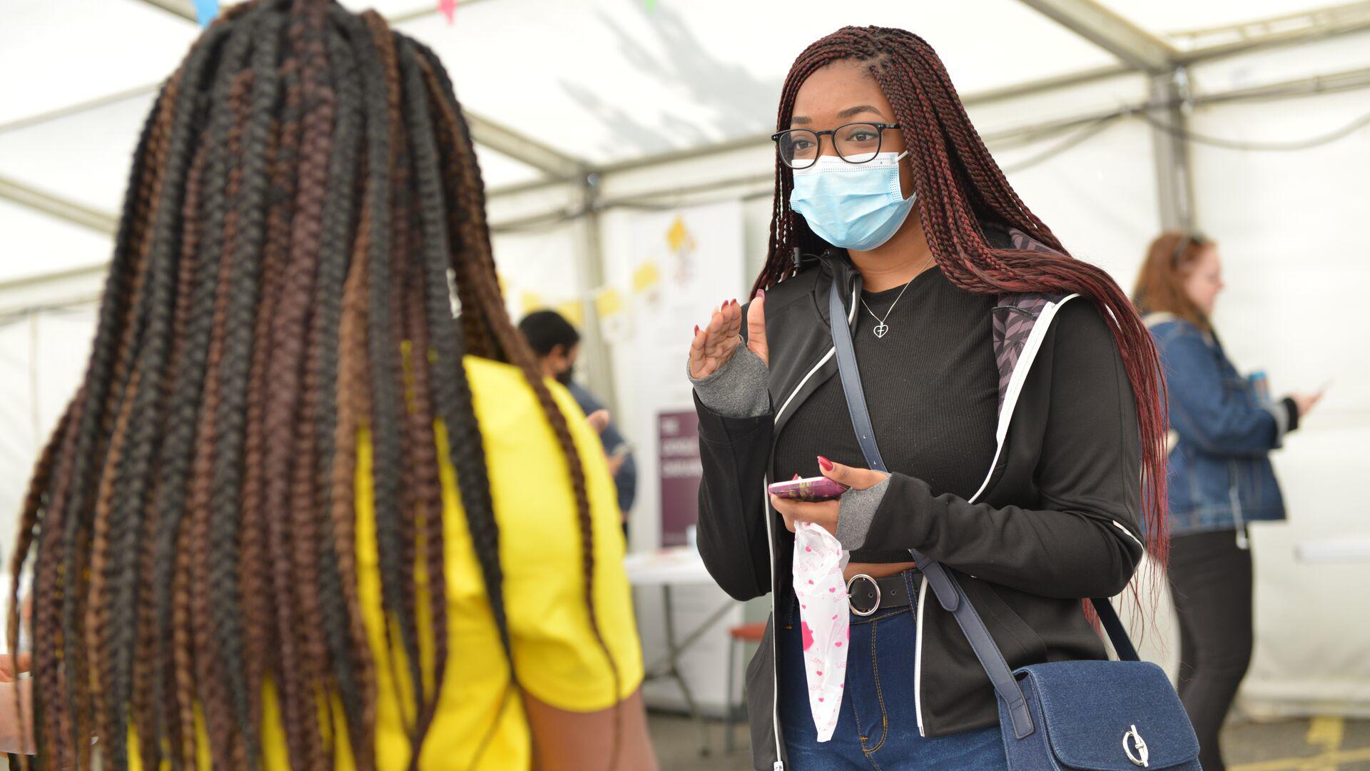 students talking in masks facemask welcome event