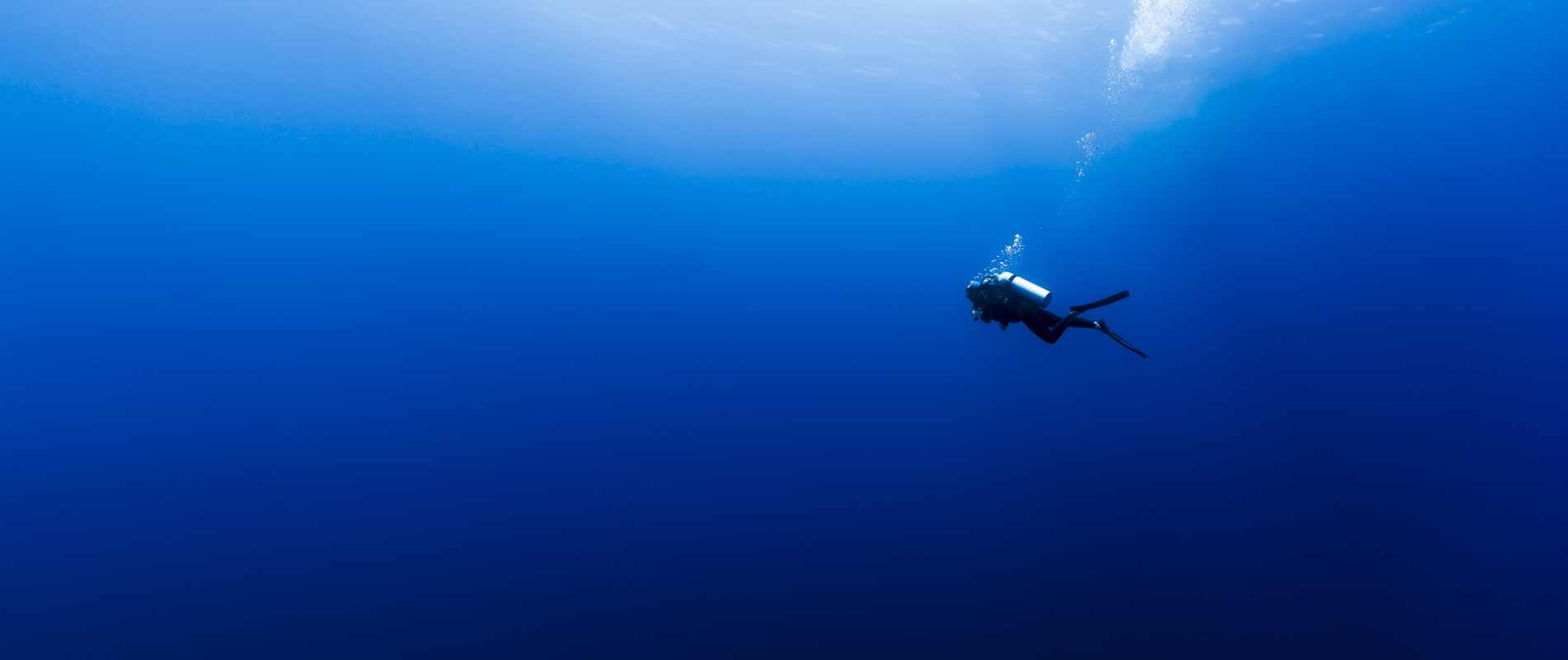 Scuba Diver in Deep Blue Sea