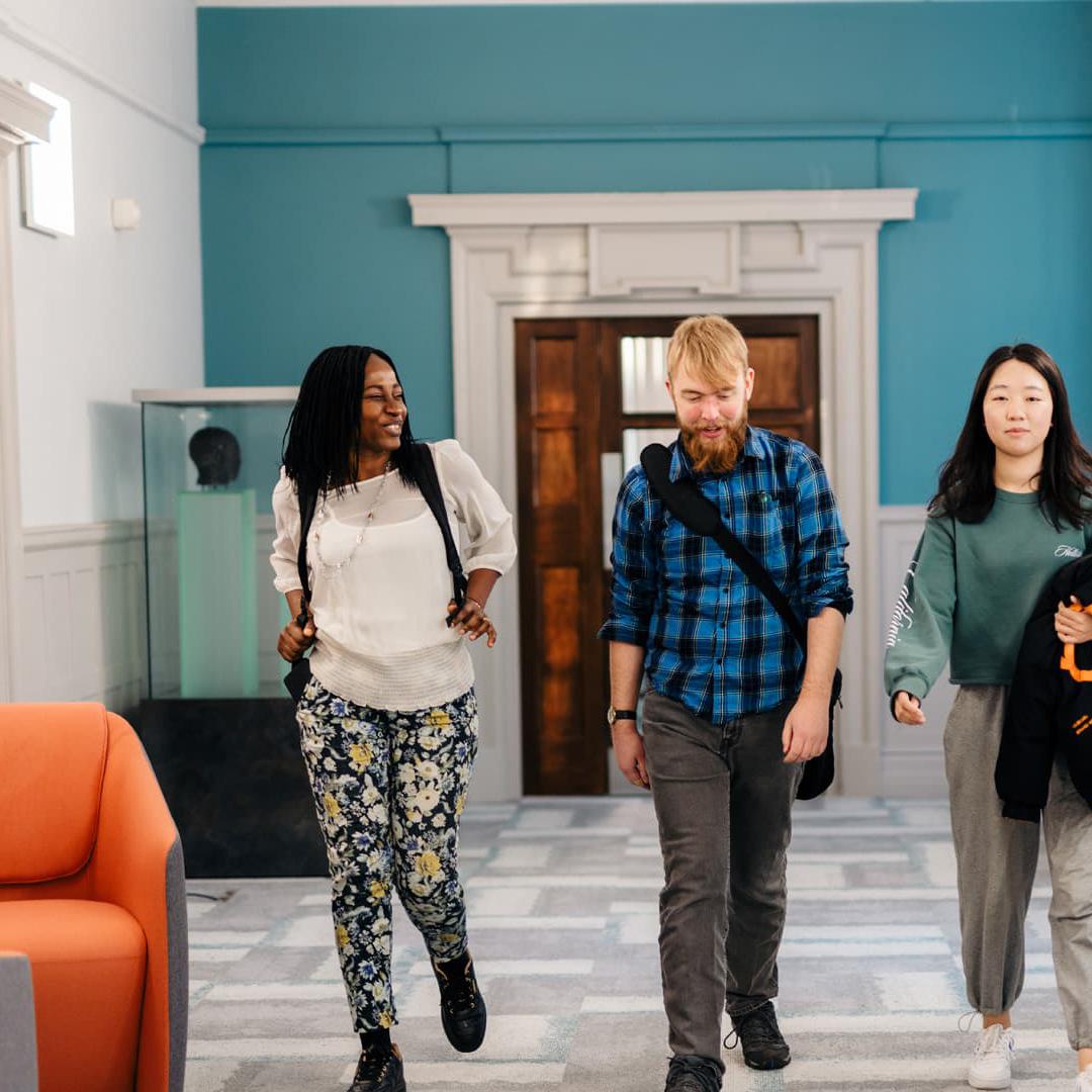 students walking through the Executive Education Suite