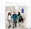 Students walking out of the Executive Education Suite