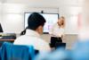 Lecturer and students in the Executive Education Suite