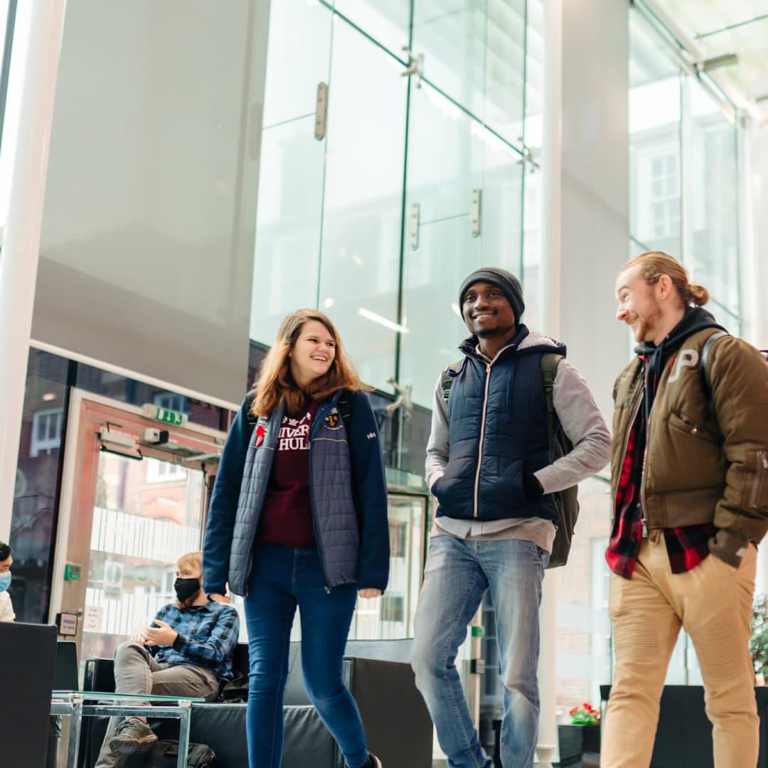 students walking together through the Nidd building