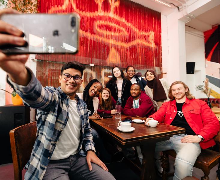 Students take a selfie in front of the Dead Bod artwork at Humber Street Gallery