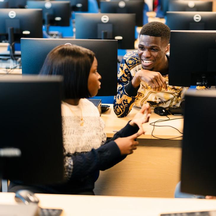 Two students in the SuperLab Computer Suite