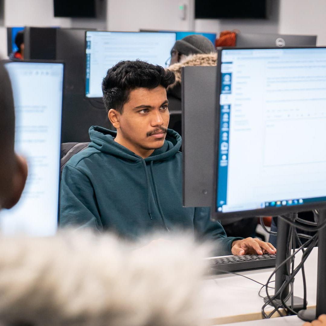 Students working on computers in DAIM