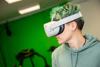 A student in the virtual reality studio wearing a Quest headset