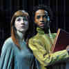 Two drama students performing a play called 'Everyman'. They are looking off-camera at something in the near distance.