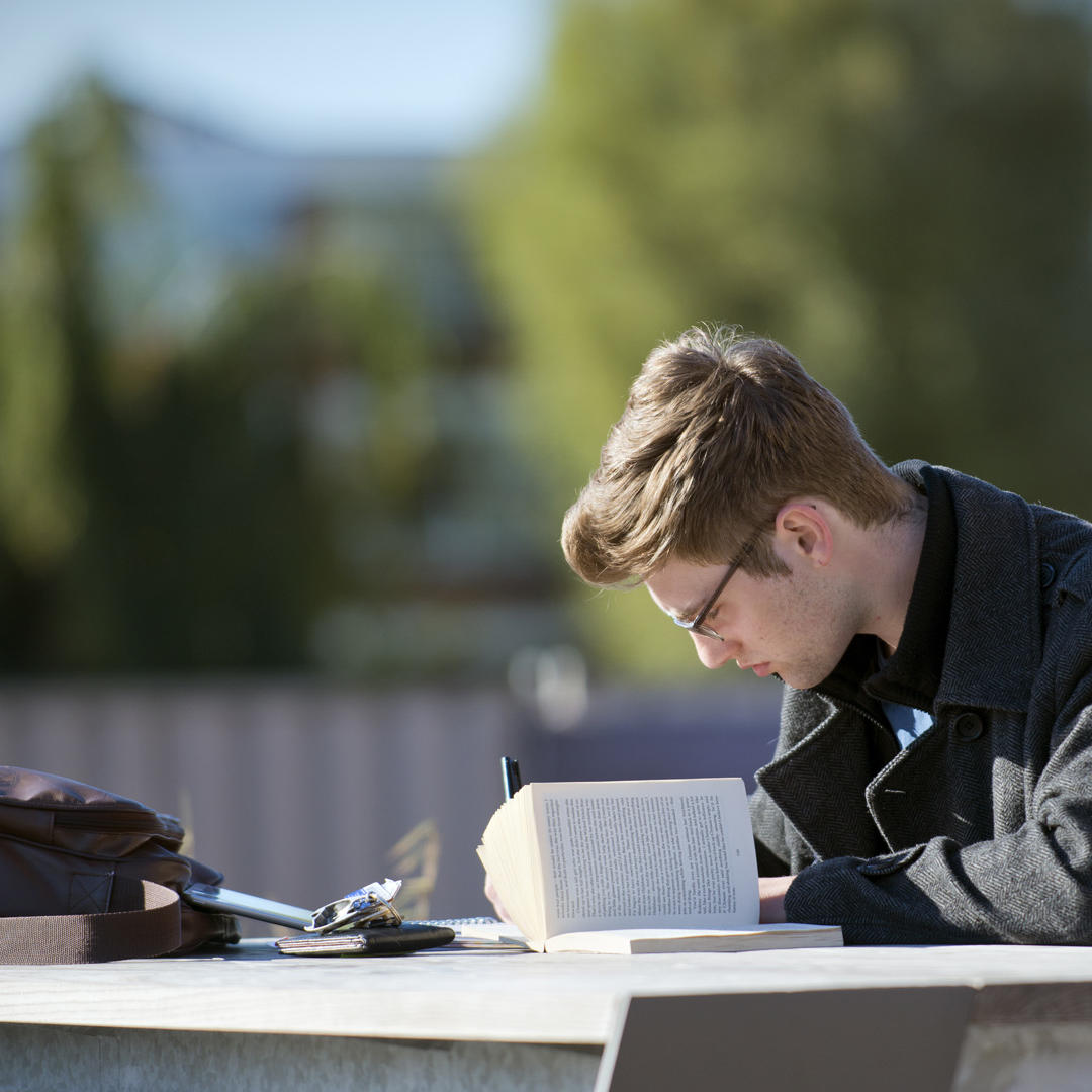 Male English Student Working Reading Outside Library BJL