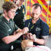 paramedic science students using dummy with tutor