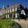 Students walk past the front of one of the University's grade 2 listed buildings