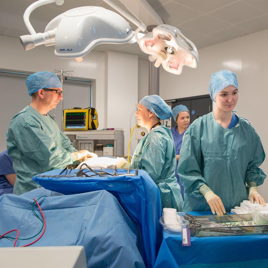 Students in scrubs learning in a simulated hospital ward at the Allam Medical Building, University of Hull.