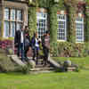 Business school students walk down the steps outside the derwent building 