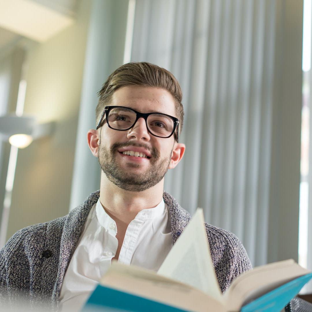 A student reading from a law book