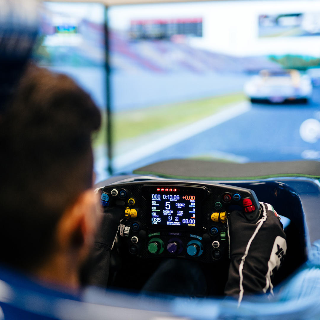 A student behind the wheel of the Hull Electric Racing Team F1 Simulator at the University of Hull.