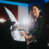 Hull Music student, Mianhua Daisy Liu, smiling to the camera and playing the piano in a University recording studio.