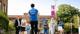 student ambassador stood with visitors on offer holder day