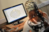 student undergoing psychology brain text using monitoring equipment