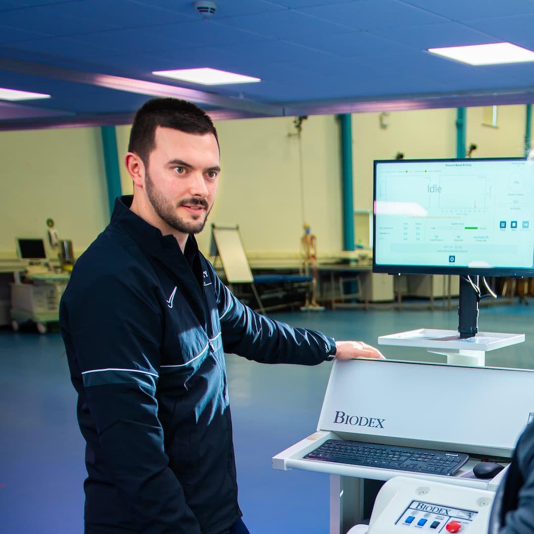 two students using Biomechanics lab equipment