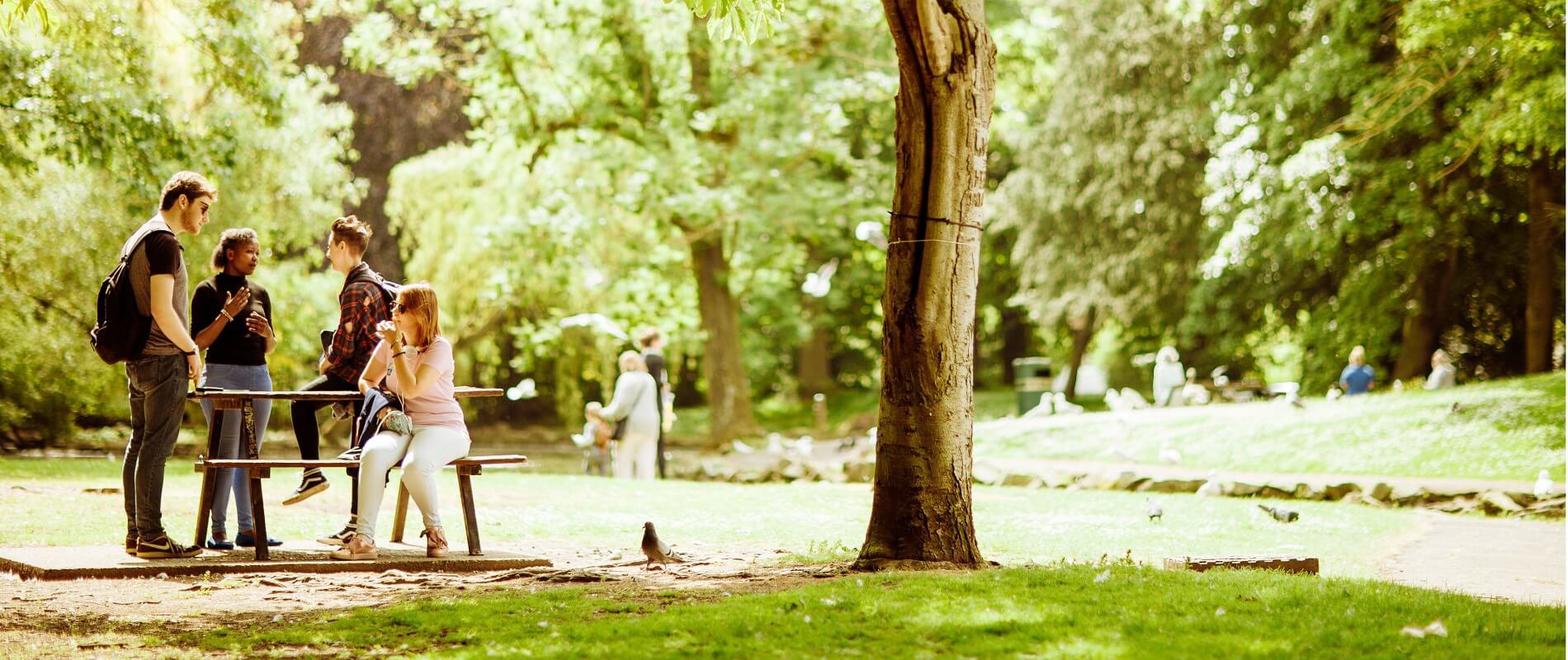 Press or Publication-Students around Picnic Bench in Pearson Park 1900x800