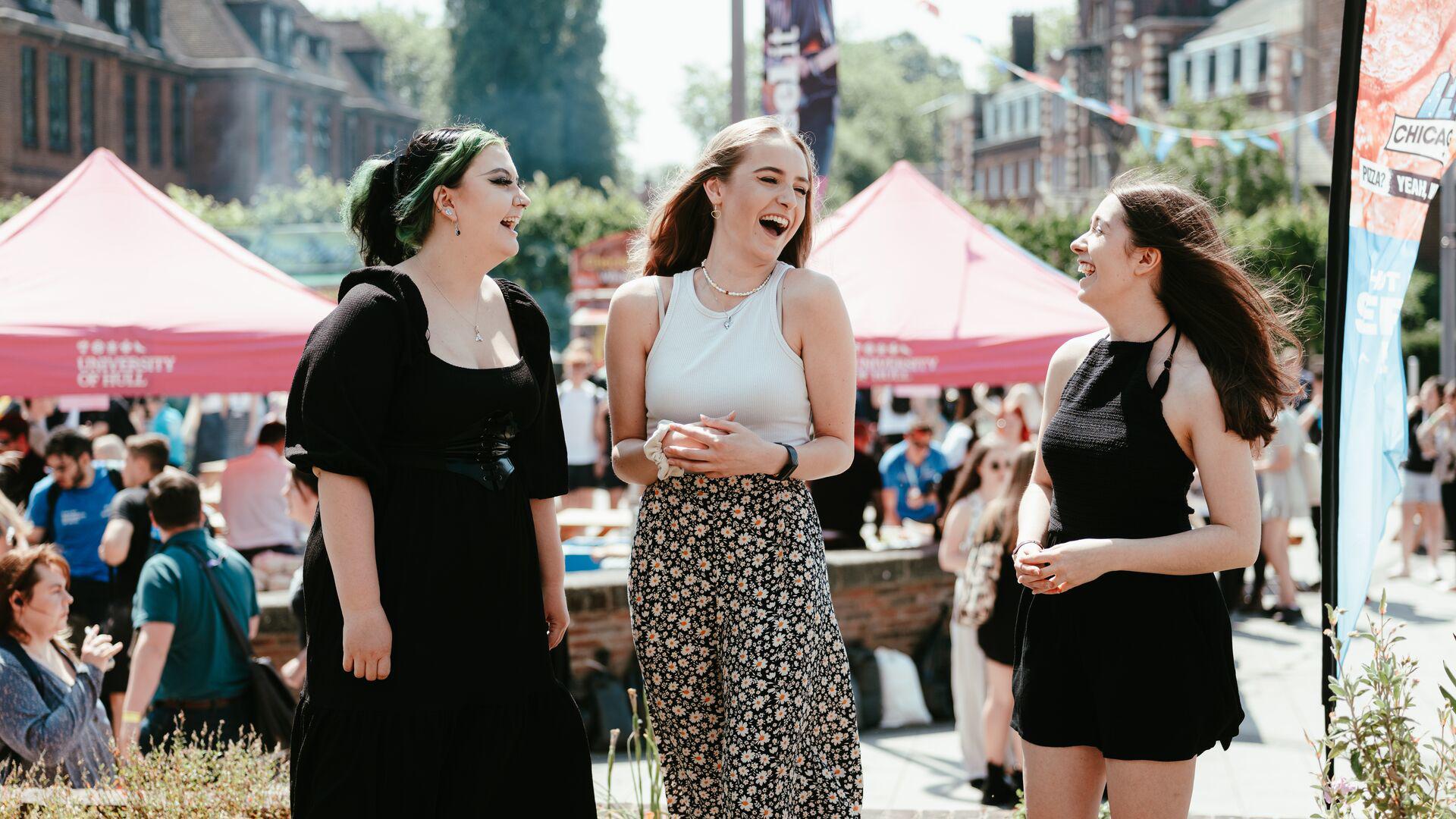 students Siobhan Jenny Smith & Amy at the festival square during an open day