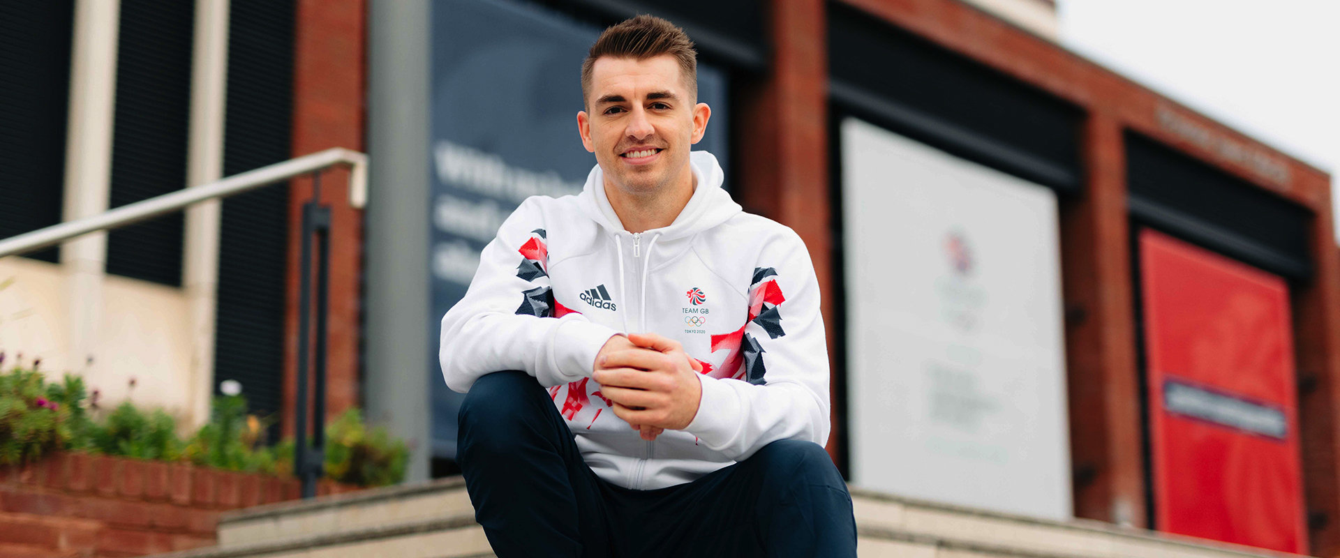 max whitlock sat infront of the university library stairs