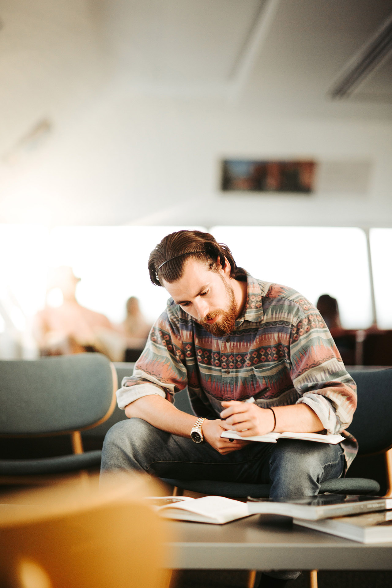 student sitting down studying in the library