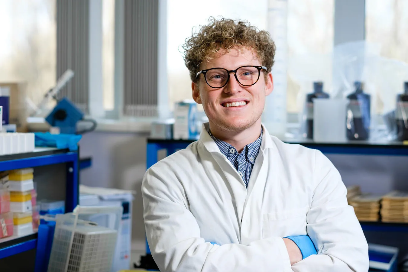 Andrew Riley, Post-Doctural Research Assistant stood, in laboratory 