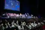Students sat in rows watching fellow students graduate