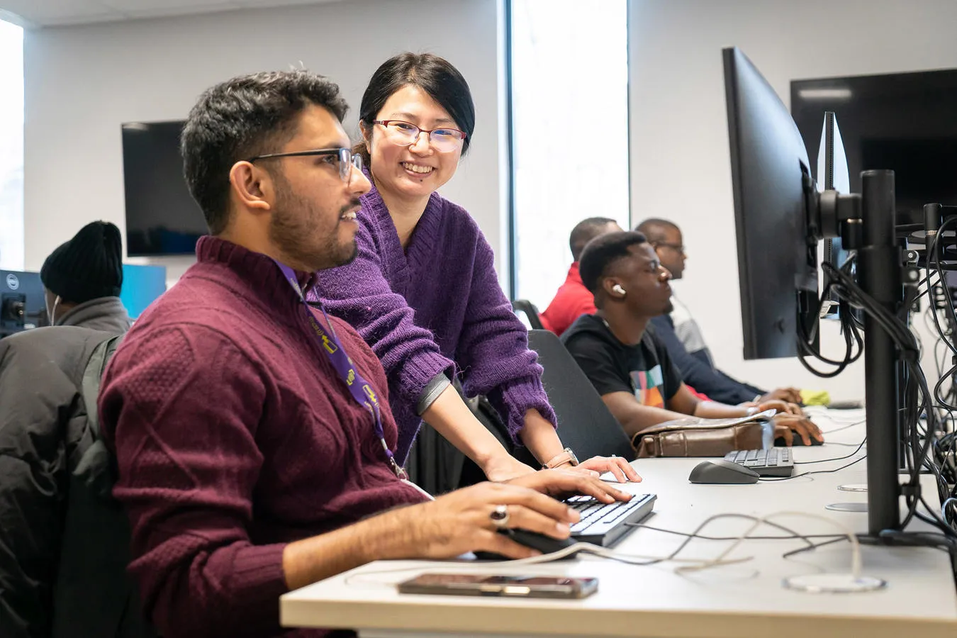 A student uses a computer in the in the DAIM building