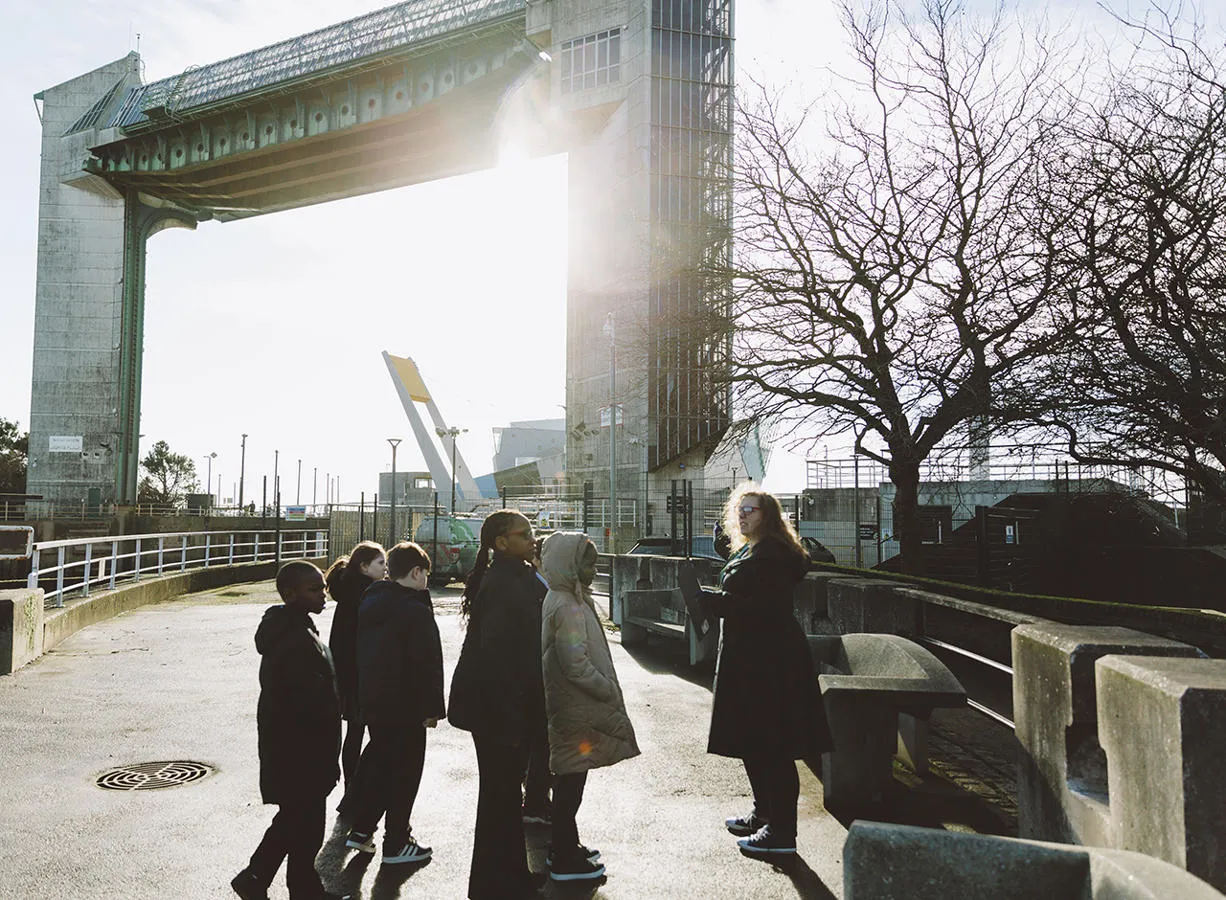 School children and teacher on a field trip to the Hull Tidal Barrier