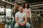 Three students in a group in student social space, the Nest