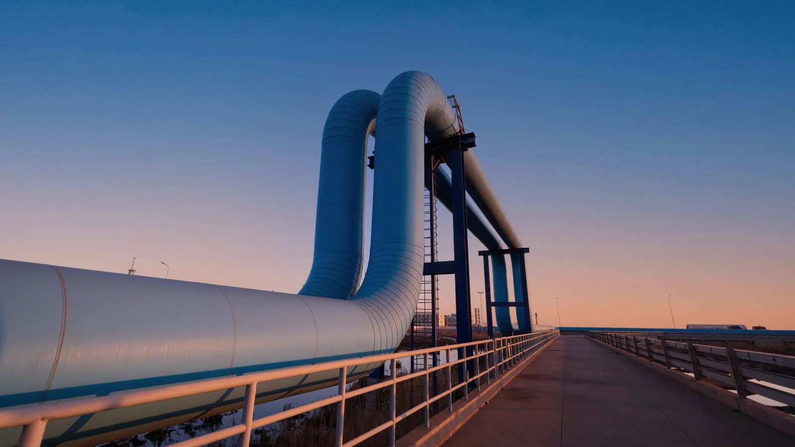 A large metal pipe at the pier