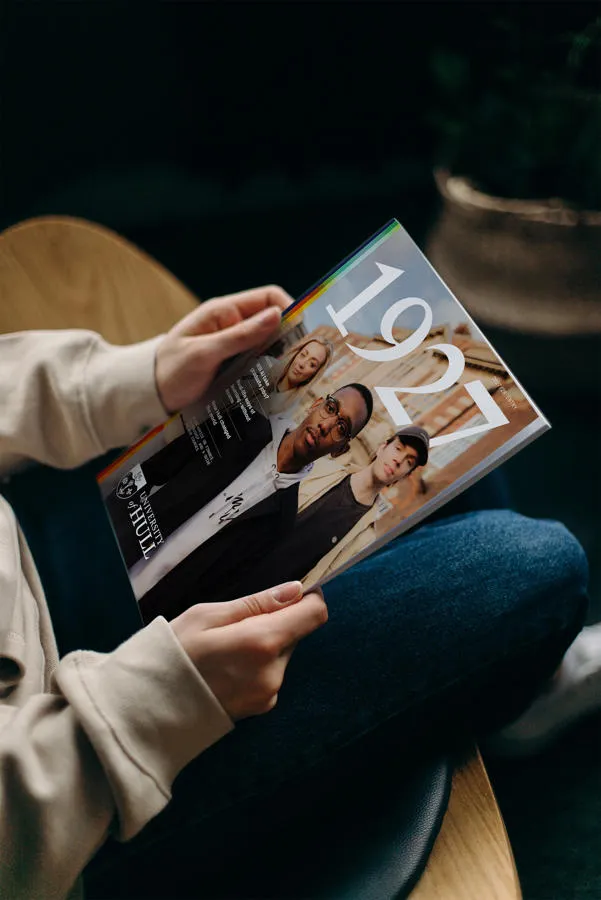 A student holds a copy of 1927 magazine