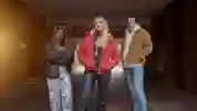 3 students posing in the tunnel