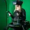 Student with a VR headset stood in front of a green screen