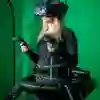 Young woman with VR headset in a green room