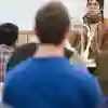 A student teacher speaking to a class of students