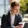 A student on a laptop on a picnic table