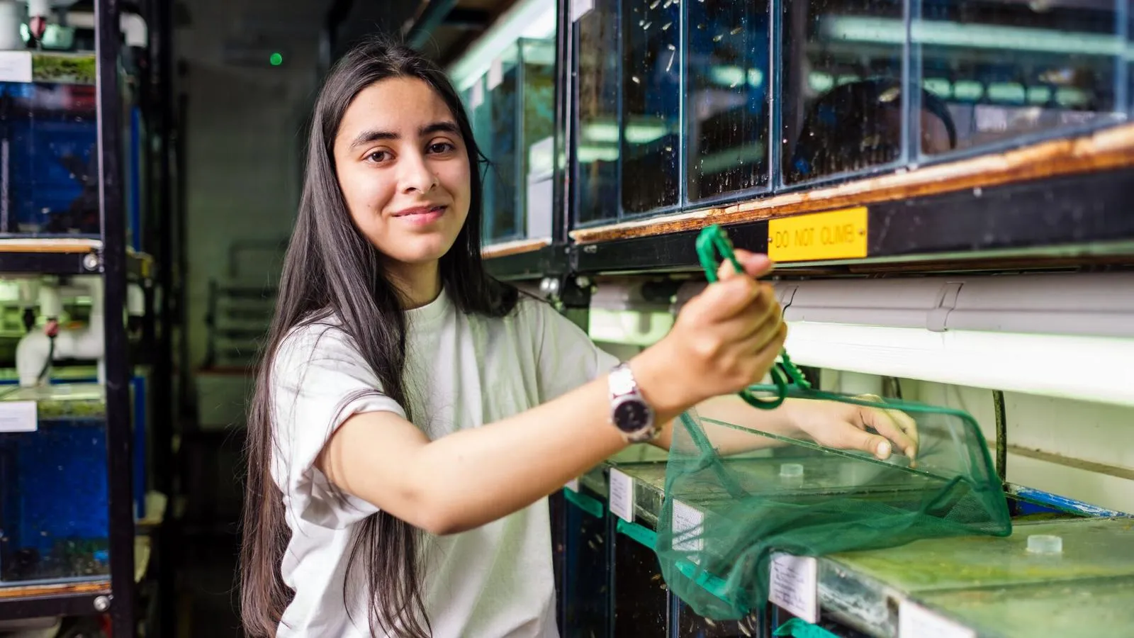 Biological Sciences PhD Student Areeba Khan in Aquarium Room at the University of Hull